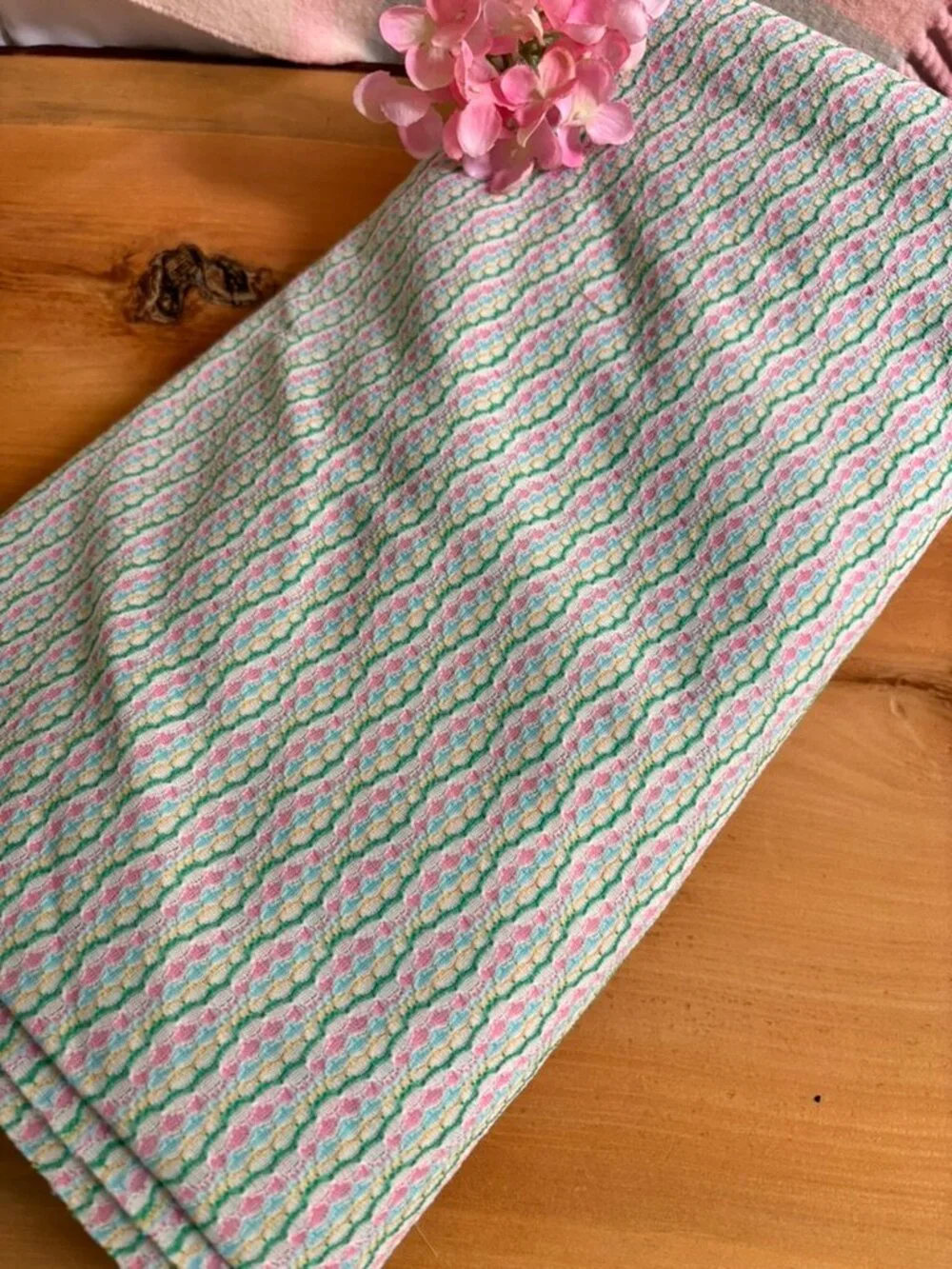 Multicolor wavy striped knit fabric with repeating pattern of pastel lines